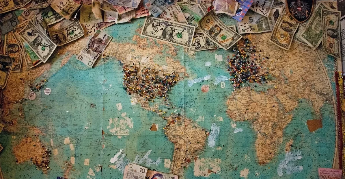 world map with money to save money for travelling atm fee saver