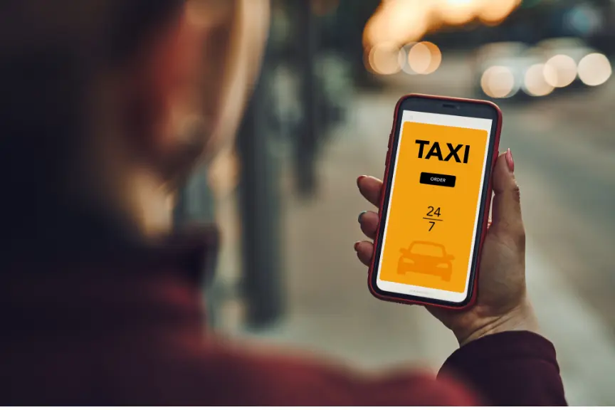 man holding Phone with a Taxi App in europe atm fee saver